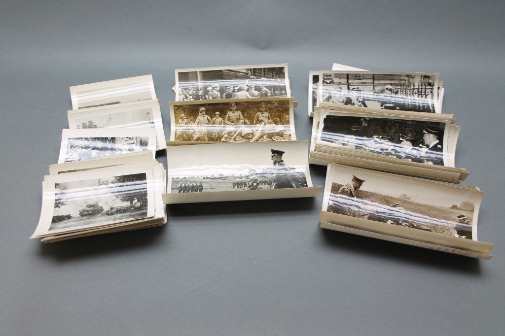 124+ WWII Photos w/ Hitler by Heinrich Hoffman: [Military/WWII] About 124 photos of WWII: with an image of bodies at the Gotha concentration camp and press photos credited to Heinrich Hoffman (1885-1957). Hoffman was a German photographer, art deal