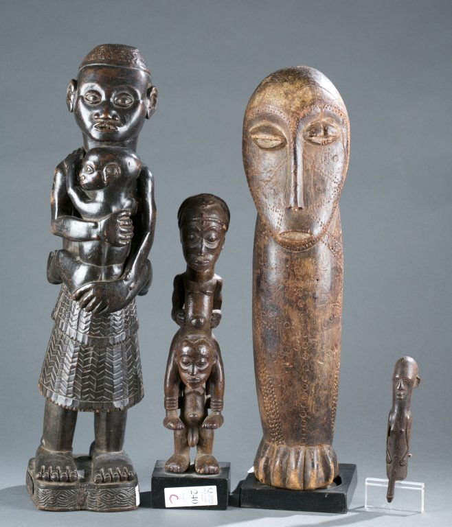 A group of four figures. (1 of 7)