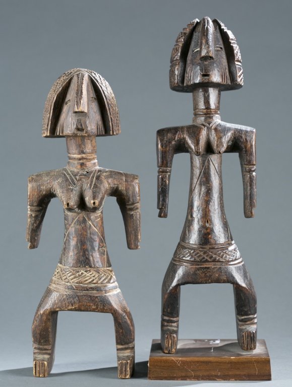 A group of two wooden dolls. (1 of 5)