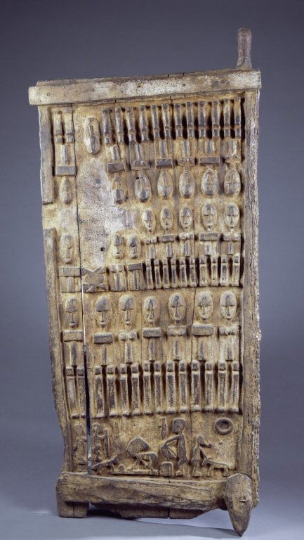 A wooden door with figures (1 of 5)