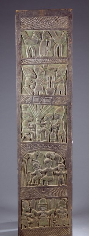 A wooden panel with rows of carved figures. (1 of 3)