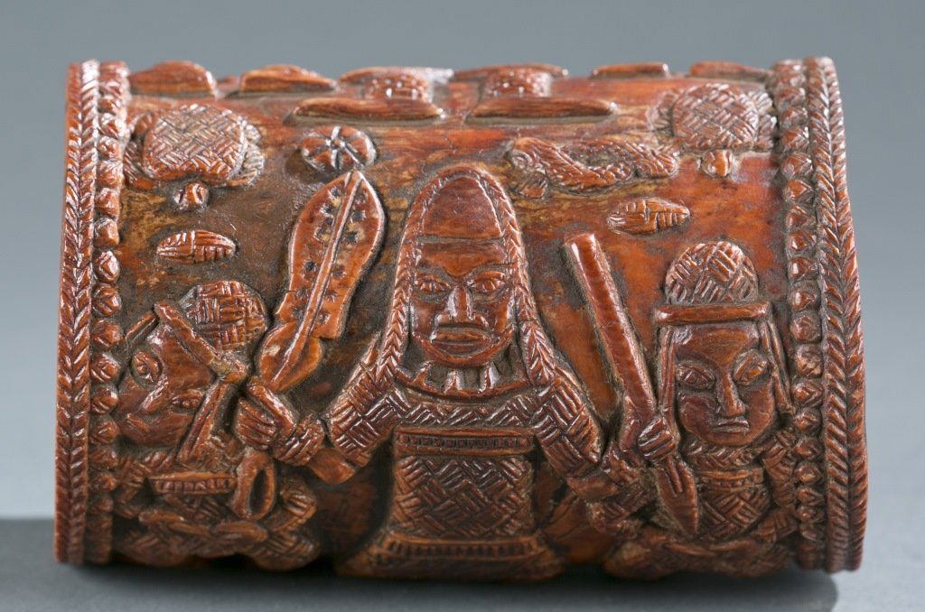 A carved ivory armlet.: A carved ivory armlet. ++ A carved ivory bracelet, Nigeria, Benin / Owo. 20th century. Provenance: The Inventory and Collection from the Estate of Merton D. Simpson.
