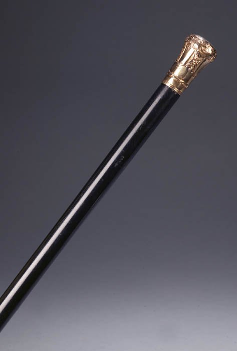 Walking cane with 22K or 24K Gold handle 19th Cent: Walking cane with 22K or 24K Gold handle on snakewood shaft. Engraved "Presented to/ROBERT WILSON/by the/FMUBTABP/214 Bowery/July 11th 1871" on handle. Length: 34 1/2 in.