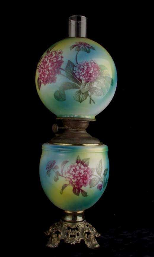 Gone With the Wind table lamp: Gone With the Wind table lamp opaque glass body painted in shades of green, yellow and blue with transfer print floral decoration on shade and body 8 inch shade shade cracked at base, continuing appro