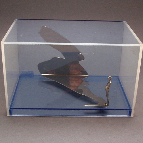 AMERICAN MODERN ART TROVA SHADOW FIGURE SCULPTURE: Ernest Trova. American, b. 1927. Shadow figure in a Box, 1971. Metal and Plexiglas. Height: 7 Inches. Width: 11 1/4 Inches. Depth: 7 1/4 Inches. Stamped monogram, date and edition number on base: 71,