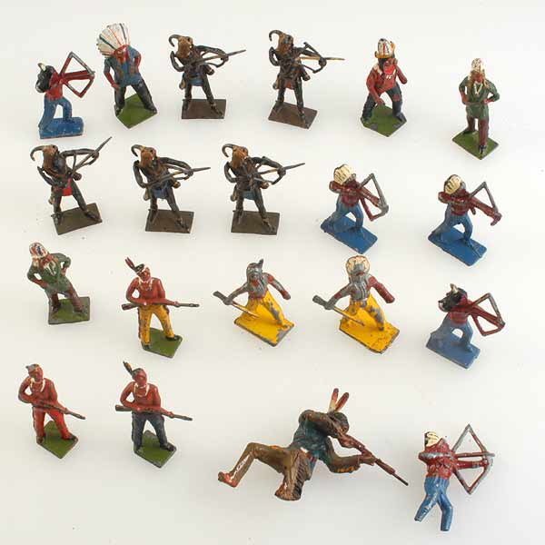 Painted Lead Tribal Indians: Grouping of Nineteen Painted Lead Tribal Indians some with bow and arrows, others with rifles. Some by Britains {paint worn}