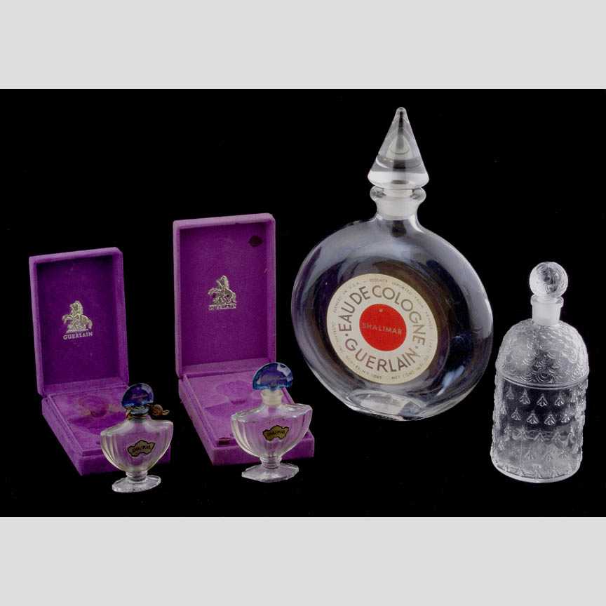 Four French molded perfume bottles, all: Four French molded perfume bottles, all made for Guerlain Perfume, Good condition, scent in the two Shalimar bottles