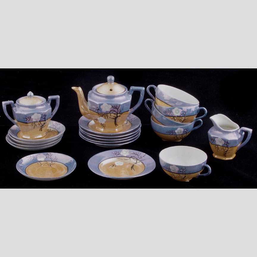 Partial Child's Tea Set, Cherry Blossom: Partial Child's Tea Set, Cherry Blossom Pattern, consisting of teapot, sugar and creamer, five cups, five saucers, and six side plates, Made in Japan stamped on bottom, one side dish chipped, glaze sl