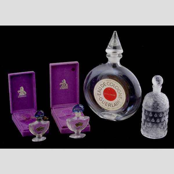 Four Guerlain Perfume bottles: Four French molded perfume bottles,; all made for Guerlain Perfume,; Good condition, scent in the two Shalimar bottles
