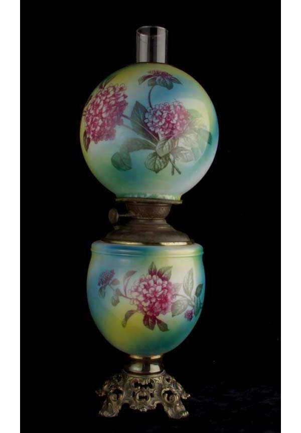 Gone With the Wind table lamp: Gone With the Wind table lamp; opaque glass body painted in shades of green, yellow and blue with transfer print floral decoration on shade and body; 8 inch shade; shade cracked at base, continuing ap