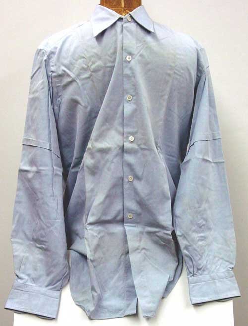 John F. Kennedy dress shirt: John F. Kennedy's Dress Shirt. Blue cotton, long sleeves, label: Brioni Roma, some discoloration. Property of M. B. Gallagher.