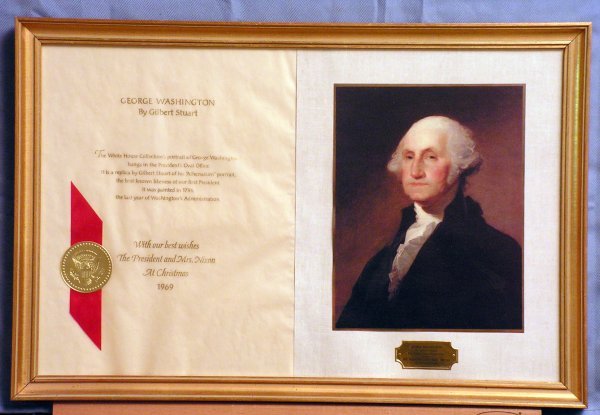 Nixon Administration Christmas gift, 1969.: Framed Christmas gift from President and Mrs. Nixon of a reproduced copy of Gilbert Stuart's portrait of George Washington from the White House Collection of paintings along with a printed explanation
