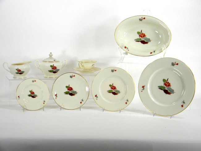 AMERICAN PORCELAIN DINNER SERVICE: Set of Castleton china lotus pattern. 13 cups and saucers, 12 bread and butter plates, 11 dessert plates, 12 salad plates, 13 dinner plates, 1 creamer and sugar, 1 oval vegetable bowl, 8 cream soups, 