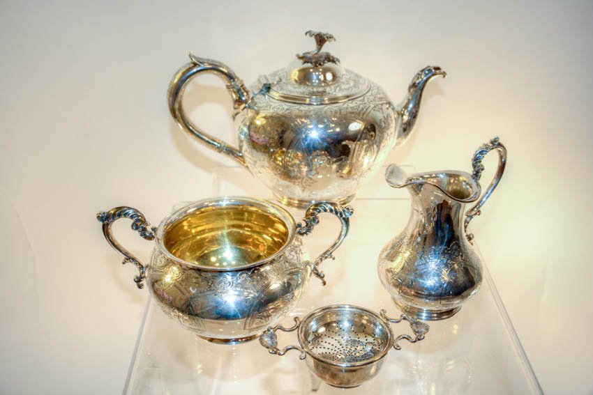Victorian Silver Partial Tea Service, and a James: Victorian Silver Partial Tea Service - comprising a Teapot, Creamer, Sugar, Total 40 ounces; James Robinson Sterling Silver Tea Strainer, 5 ounces