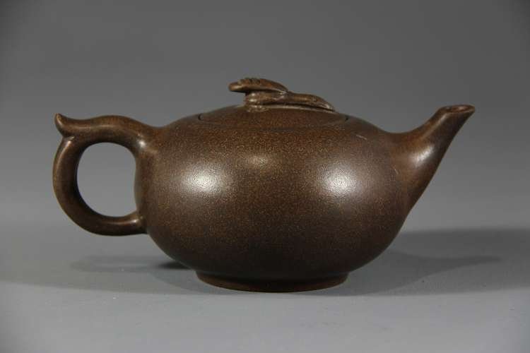 YiXing Teapot With Mark: 蒋丽萍制款洒金壶 W: 17.3cm; H: 9cm; D: 11.7cm.