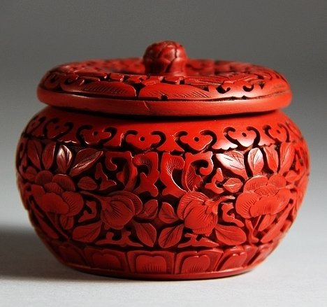 Qing Cinnabar Lacquer Lidden Box with Floral Design: Qing Cinnabar Lacquer Lidden Box with Floral Design 清代剔红雕花卉纹带钮盖盒 H: 6.6cm; D: 8.5cm.