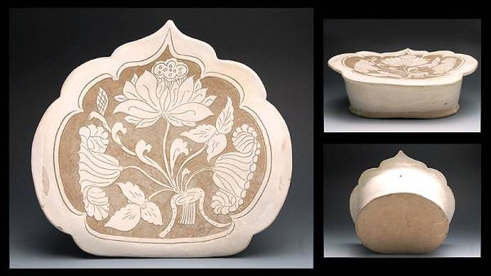 A SONG DYNASTY CI ZHOU KIND WHITE GLAZED PORCELAIN NECK: A Song Dynasty Ci Zhou Kind White Glazed Porcelain Neck Rest 宋代磁州窑白釉刻花瓷枕 H: 13cm; W: 32.cm; L: 30cm.