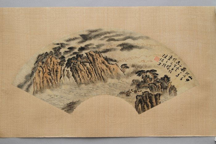 A LU YANSHAO 'PINE TREES AND LANDSCAPE' FAN PAINTING: A Lu Yanshao 'Pine Trees And Landscape' Fan Painting 陆俨少款松山云豁图扇面 H:24cm W:4cm