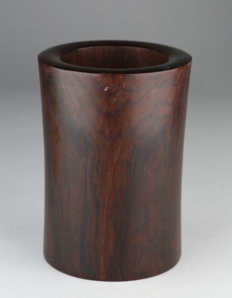 A ROSEWOOD CARVED BRUSHPOT: It is carved in cylindrical shape, of rich brown tone. 酸枝笔筒 H:16cm; D:11.5cm; Weight:835g