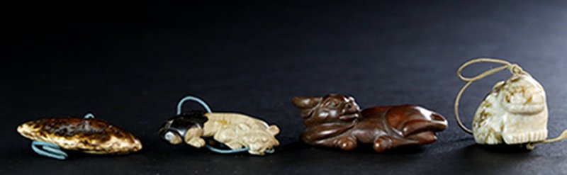 A SET OF JADE CATTLE FITTINGS (1 of 4)