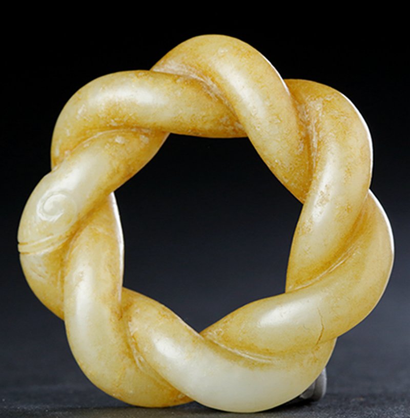 A TWISTED STRIP JADE ARM FITTING (1 of 4)