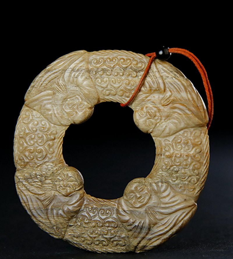 A CARVED LUOHANS DISC (1 of 4)