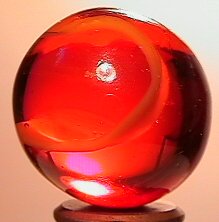 67352 BB Marbles: Peltier Root Beer Float: PELTIER GLASS COMPANY, Root Beer Float. Transparent brown marble with wide opaque white ribbon in it. From the limited run of Nova types by Peltier. Ottawa IL, circa 1975-1980. 31/32". Mint (9.7).