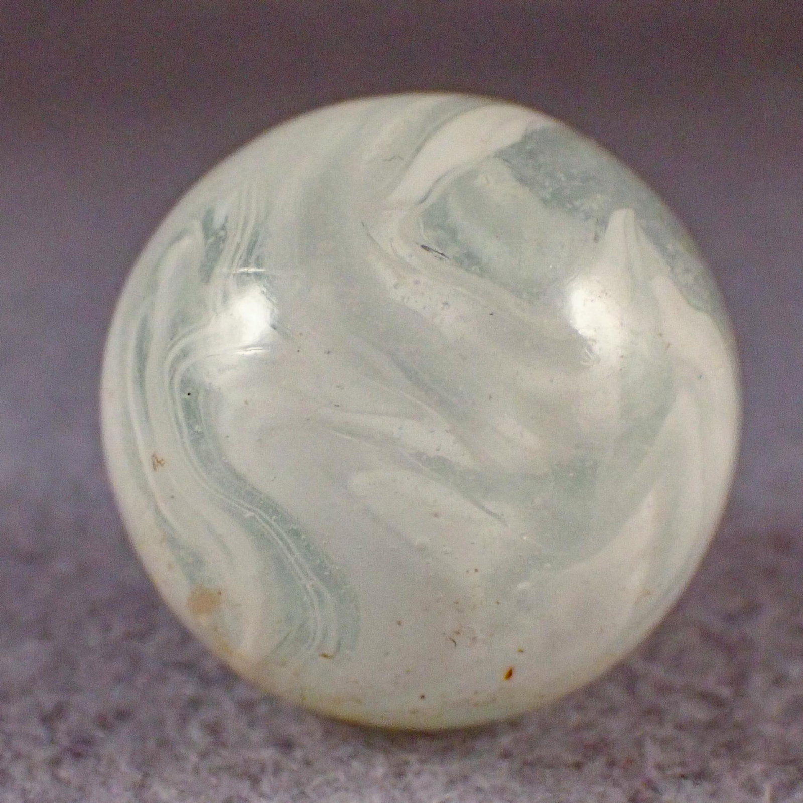 MARBLES. AKRO AGATE COMPANY, Slag. 15/16". Mint (9.7).: AKRO AGATE COMPANY, Slag. Clear white Slag. Clarksburg WV, circa 1925-1935. 15/16". Mint (9.7).