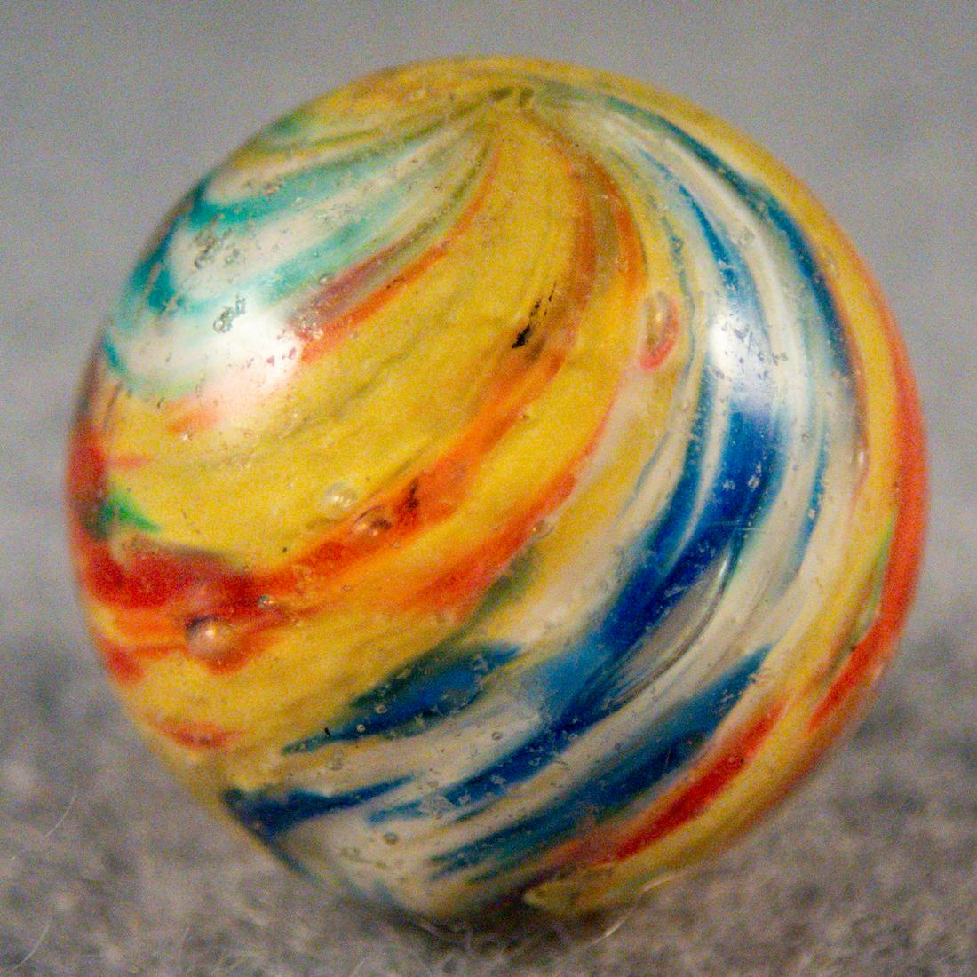 Marbles. END OF DAY, Paneled Onionskin. 11/16". Mint(-) (9.0).: END OF DAY, Paneled Onionskin. Four-Panel Onionskin. Two panels of pink on yellow, one panel of blue on white, one panel of turquoise on white. Manufacturing melt spot. Germany, circa 1860-1920. 11/16