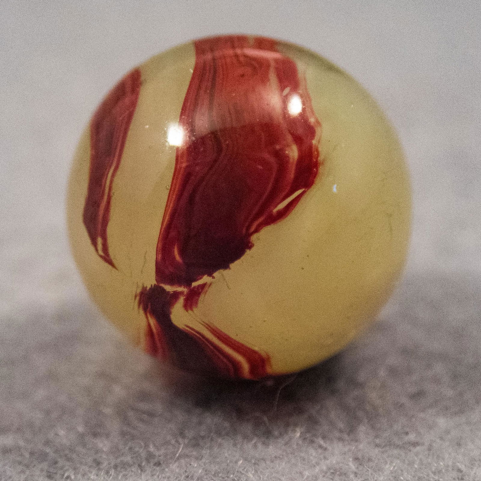 Marbles: AKRO AGATE COMPANY, Lemonade Oxblood. 19/32". Mint (9.6). (1 of 7)