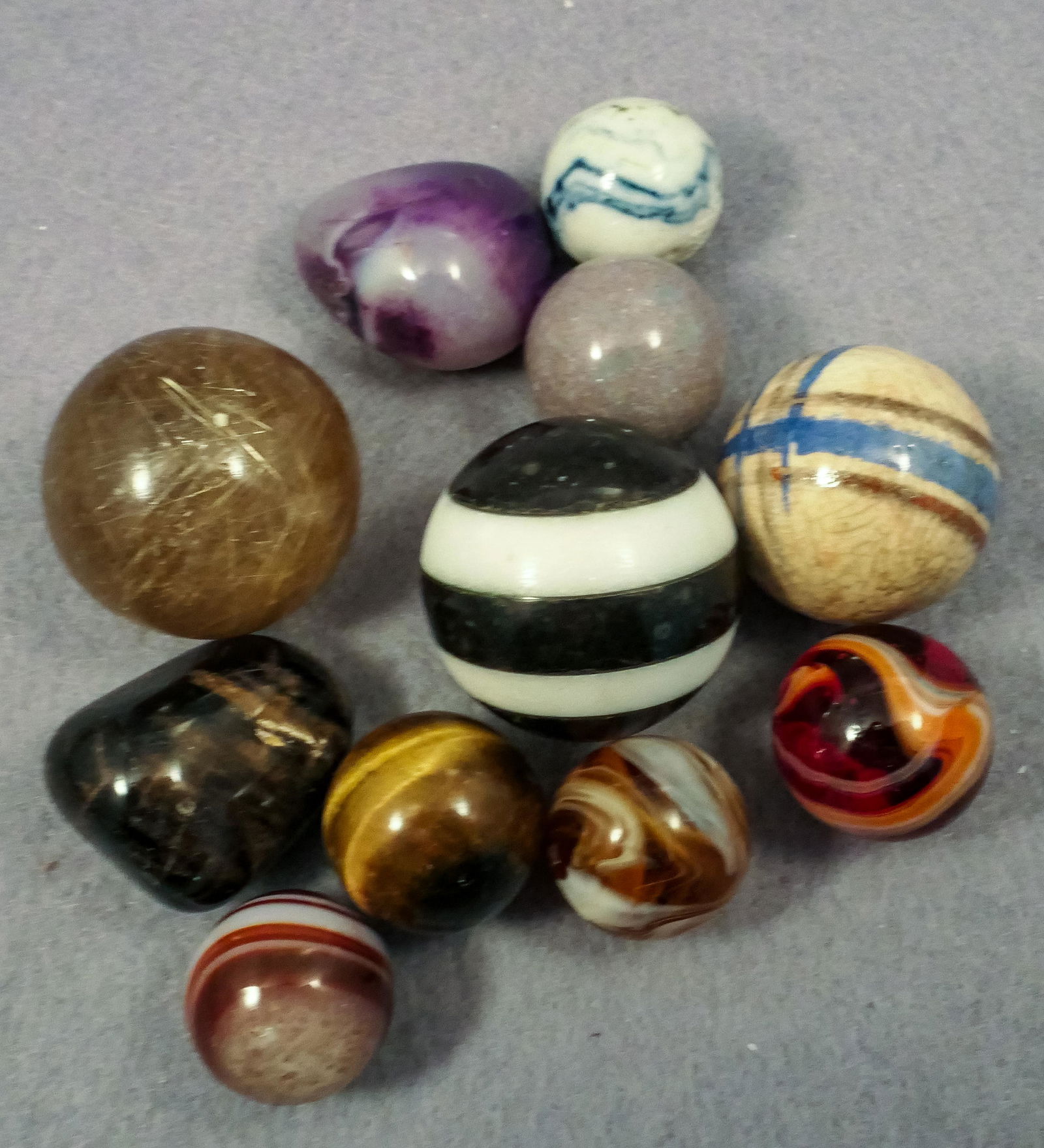 Marbles: ASSORTED. 9 marbles and 2 items. (1 of 2)