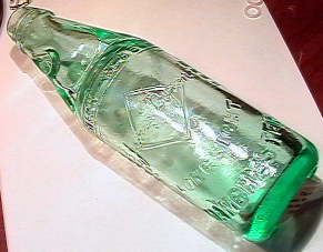 84105 BB Marbles: English Codd or Marble Bottle MISCELL: 84105 BB Marbles: English Codd or Marble BottleMISCELLANEOUS, Codd Bottle. Old bottle with glass marble in the neck that acts asthe stopper. Used for mineral water and soda. Bottle reads "James Dyson