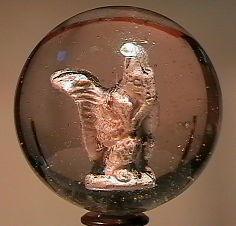 84150 BB Marbles: Squirrel Sulphide 1-15/16" 9.1 SULPHI: 84150 BB Marbles: Squirrel Sulphide 1-15/16" 9.1SULPHIDE, . Figure is a standing squirrel, eating a nut. Well centered. No air bubbles.Surface has some minor rubbing and pinpricks, but it is in remark