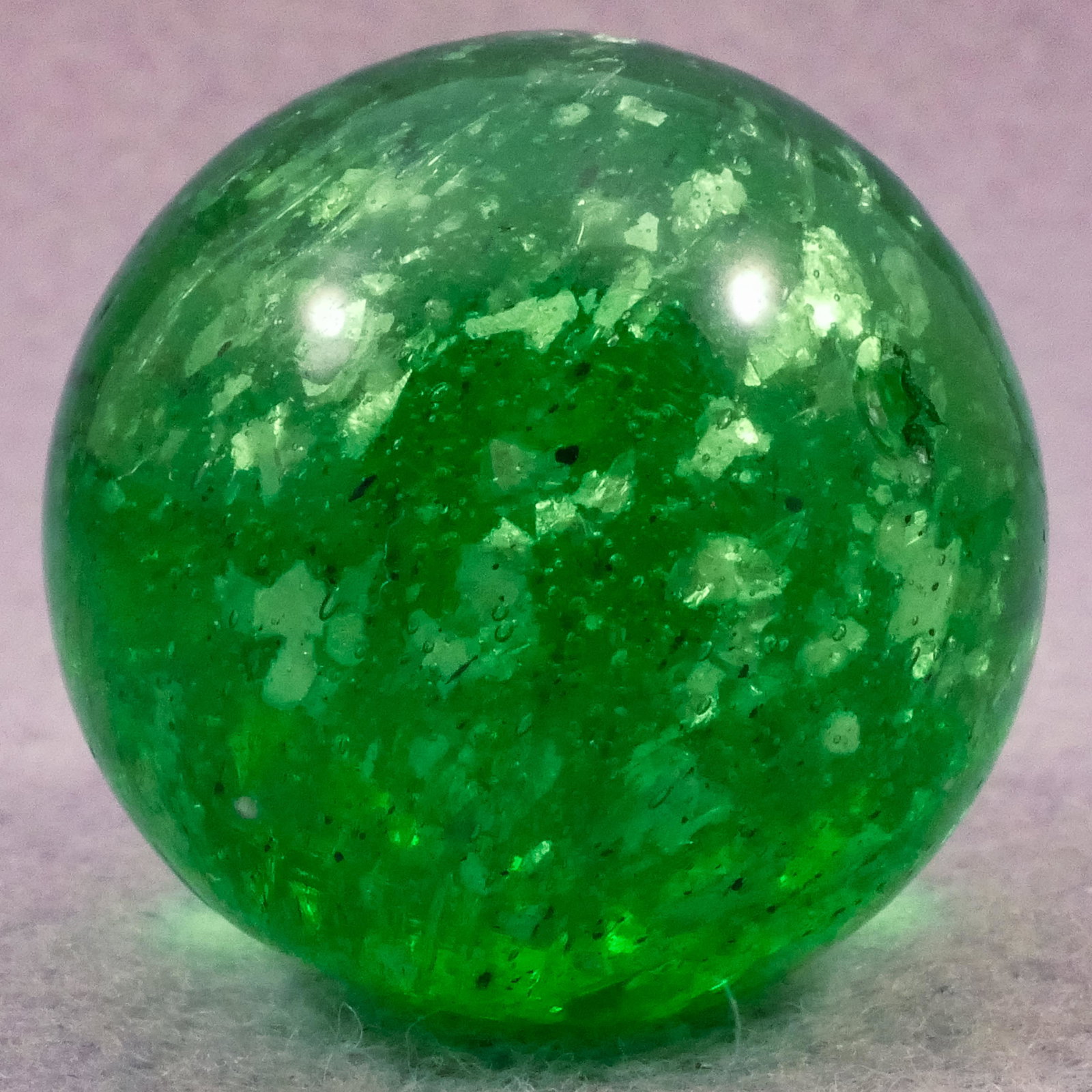 Marbles: OTHER HANDMADE, Mica. 1-1/16". Near Mint(+) (8.7).: OTHER HANDMADE, Mica. Large emerald green Mica. Faceted pontil, but large flake on the bottom. Germany, circa 1860-1920. 1-1/16". Near Mint(+) (8.7).