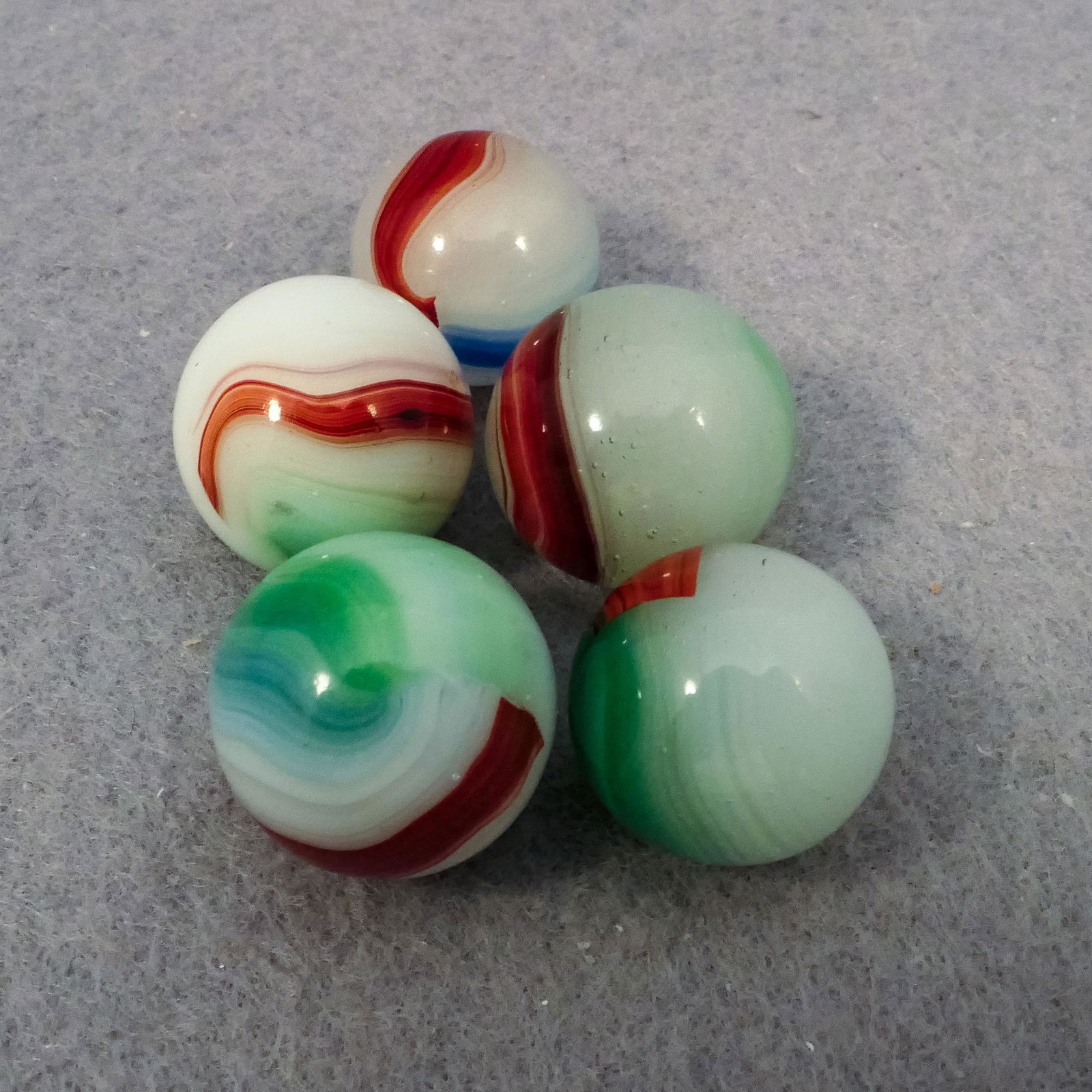 Marbles: AKRO AGATE COMPANY, Patch Oxblood. 5 marbles. (1 of 4)