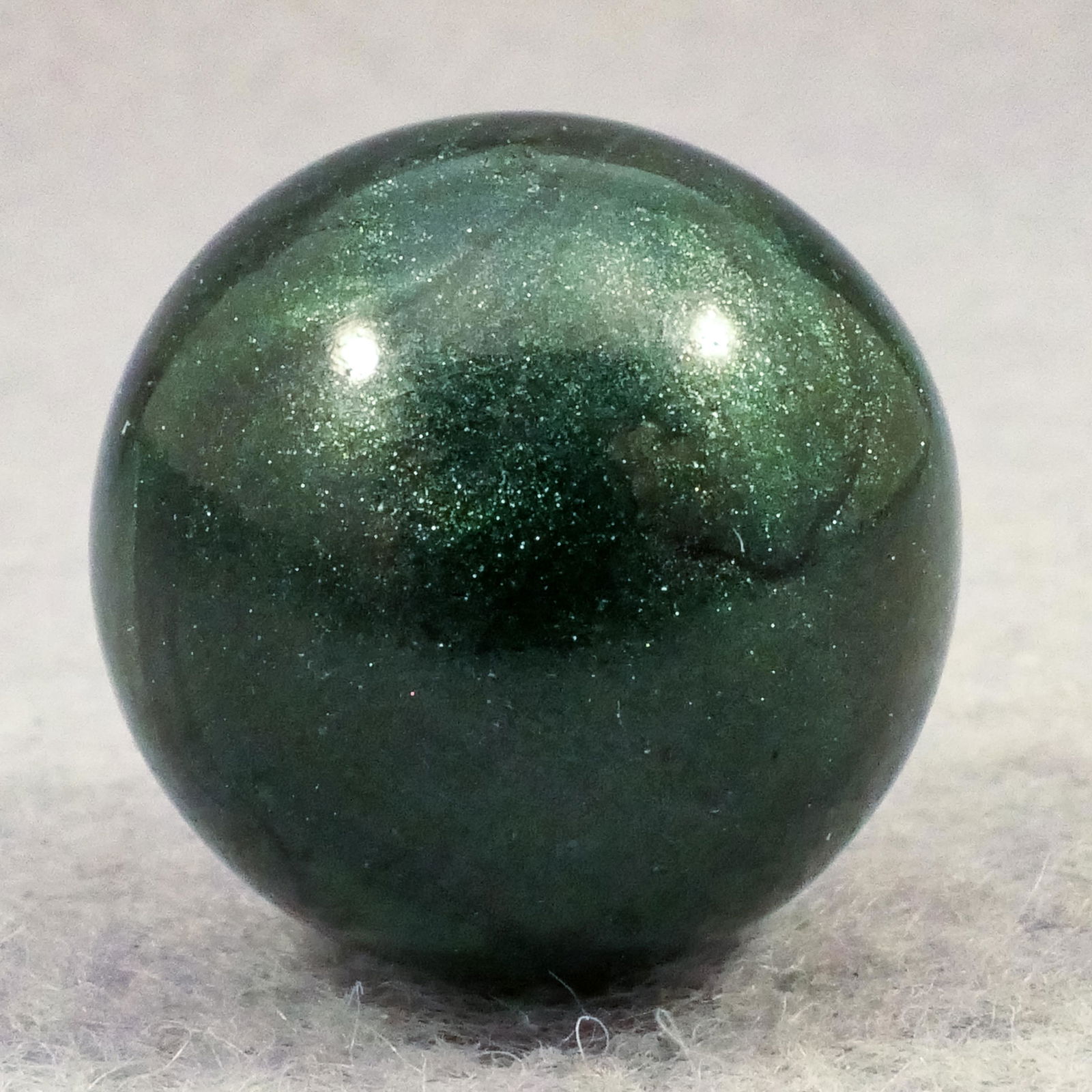 Marbles: MASTER MARBLE COMPANY, Opaque. Aventurine. 11/16". Mint (9.9).: MASTER MARBLE COMPANY, Opaque. Aventurine green opaque marble. Clarksburg WV, circa 1930-1940. Provenance: ex-collection Catherine Kortvely 11/16". Mint (9.9).