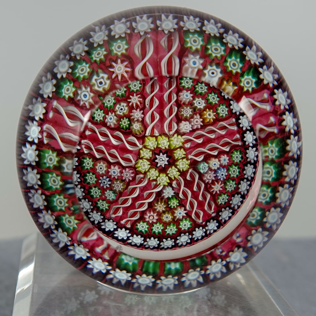 PAPERWEIGHT, Perthshire Paperweights. PP60.: PAPERWEIGHT, Perthshire Paperweights. Perthshire PP60 general line paperweight. Beautiful colors. Top window. Center signature cane of a "P". 2-1/2" width, 1-3/4" height. Mint.