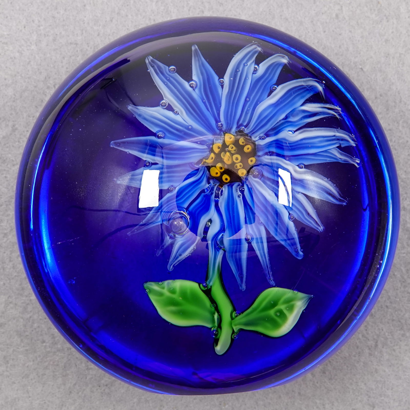 PAPERWEIGHT, Chinese. Modern.: PAPERWEIGHT, Chinese. Flower in a disk. One side of the disk is ground flat so it stands upright. Unsigned. 2-1/4" width, 1-7/8" height. Mint.