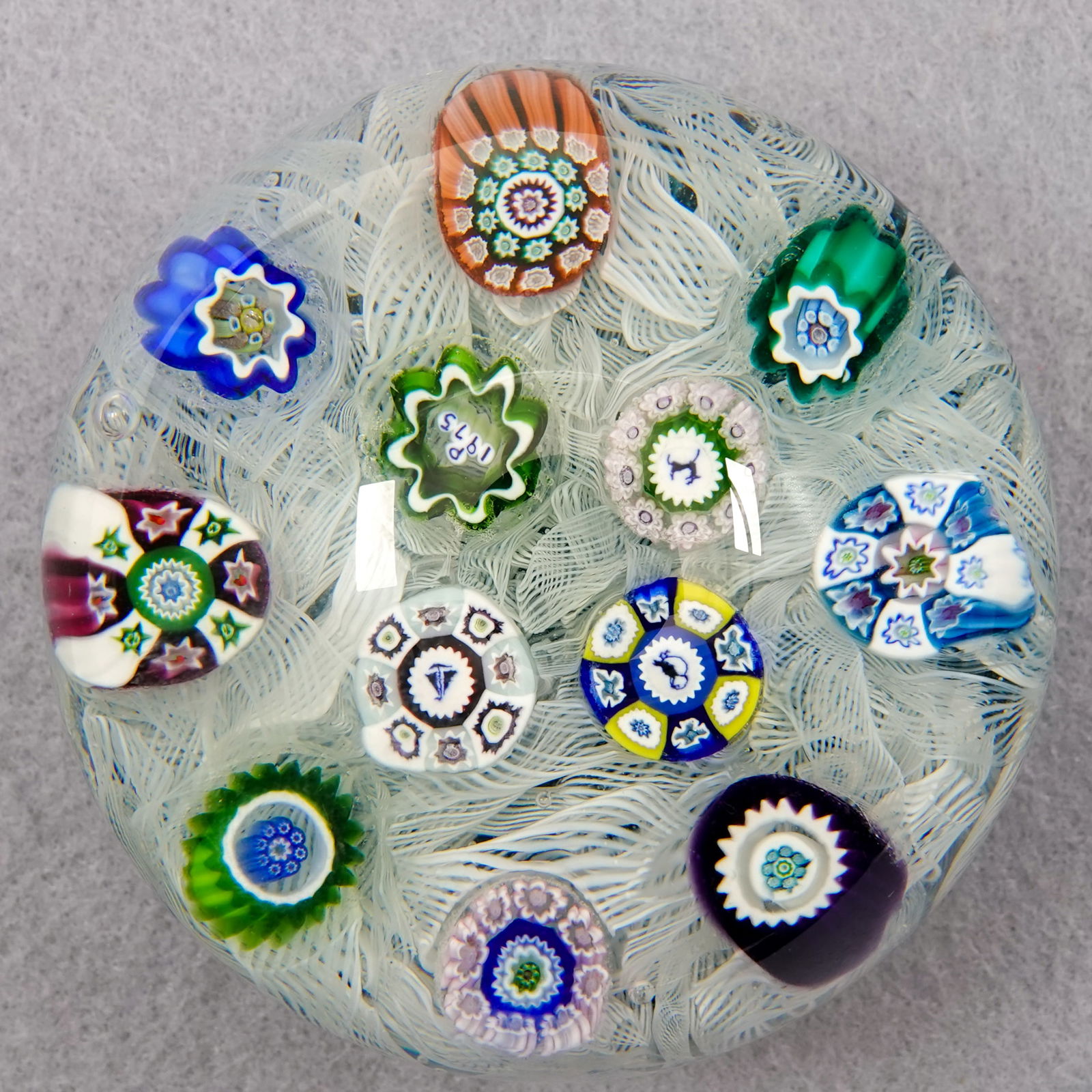 PAPERWEIGHT, Perthshire Paperweights. PP13.: PAPERWEIGHT, Perthshire Paperweights. Perthshire PP13 1975. Three silhouette canes and a date cane "P 1975". Limited edition. 2-3/4" width, 2" height. Mint.