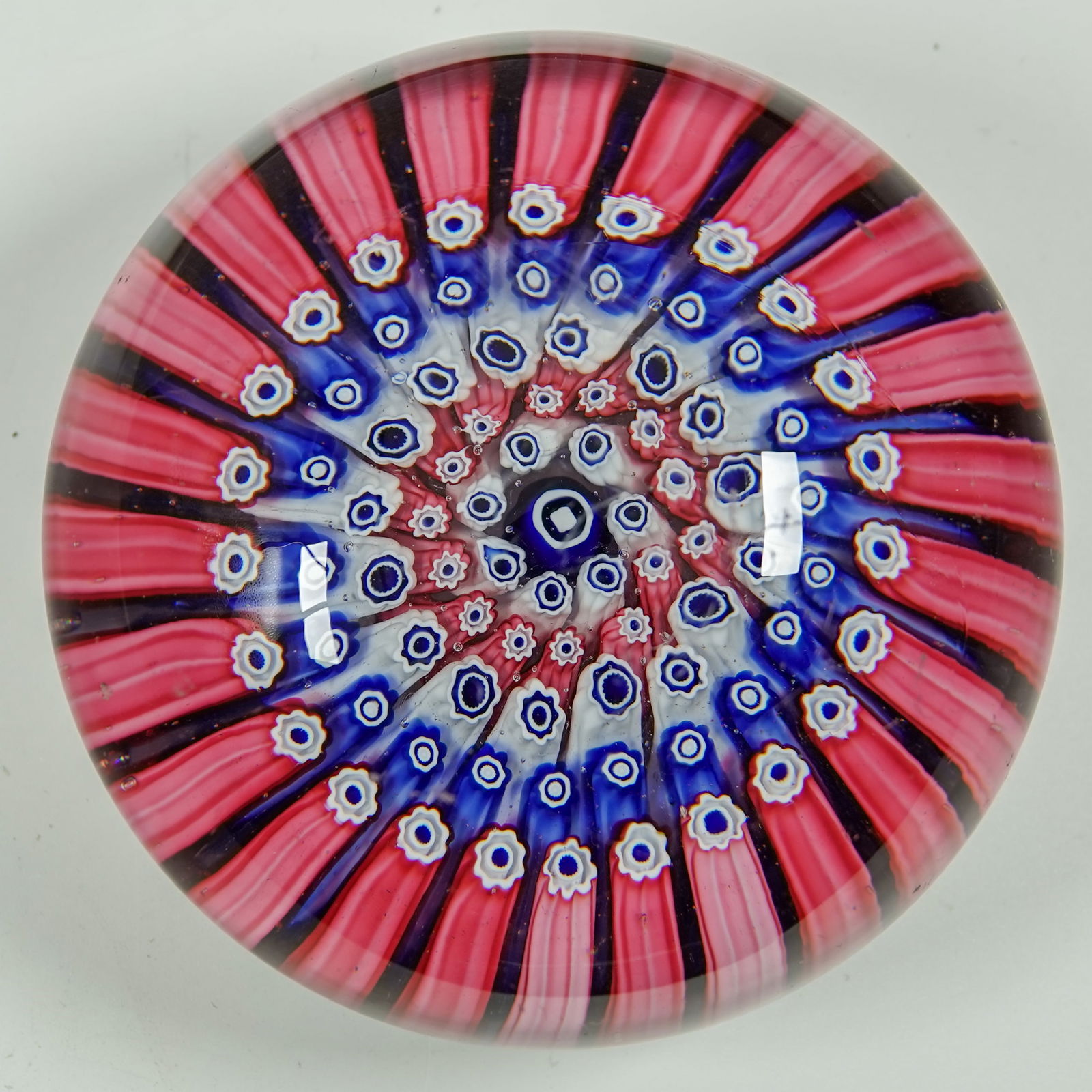 PAPERWEIGHT, Whitefriars.: PAPERWEIGHT, Whitefriars. Nice concentric ring pattern. England, circa 1950s. 3" width, 1-1/4" height. Mint.