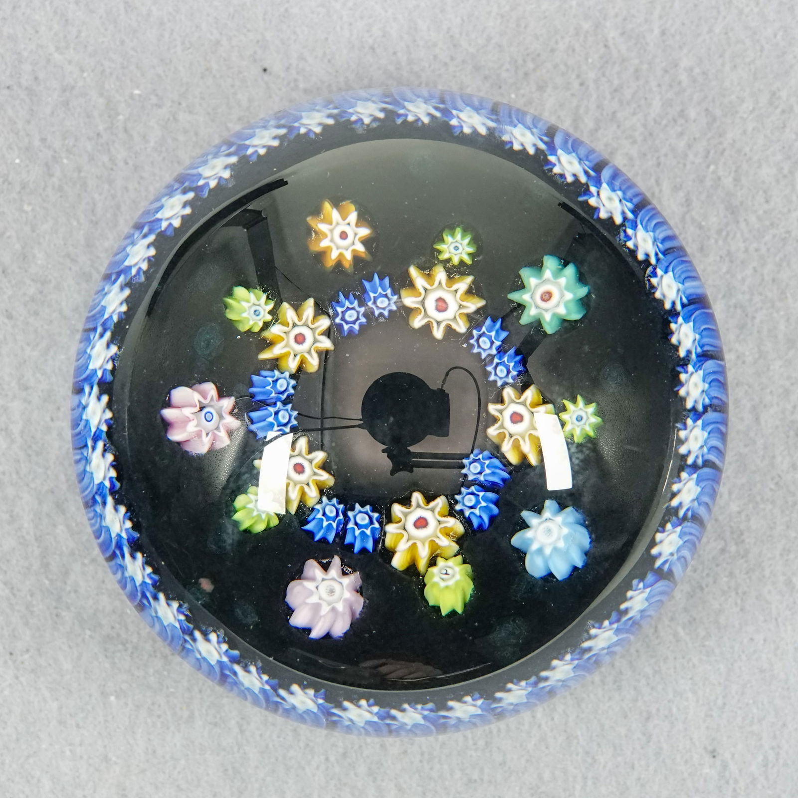 PAPERWEIGHT, Perthshire Paperweights. PP89.: PAPERWEIGHT, Perthshire Paperweights. Perthshire PP89 paperweight. Has a "P" cane. Scotland, circa 1990. 2-5/8" width, 1-7/8" height. Mint.