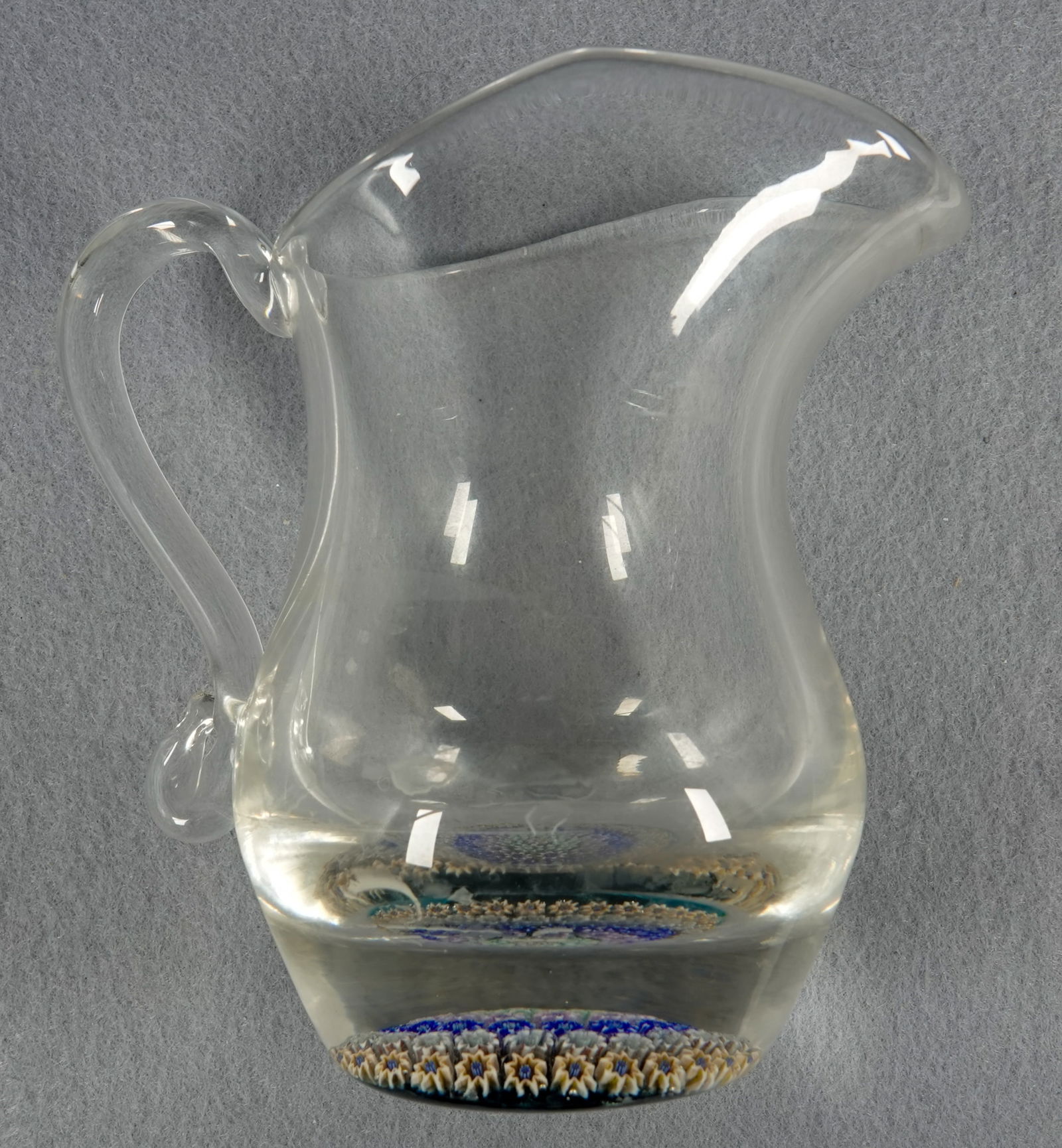 PAPERWEIGHT, Perthshire Paperweights. PP23.: PAPERWEIGHT, Perthshire Paperweights. Perthshire PP23. Creamer jug or pitcher. Concentric ring millefiori in base. Scotland, circa 1975. 2-3/4" width, 4-1/4" height.