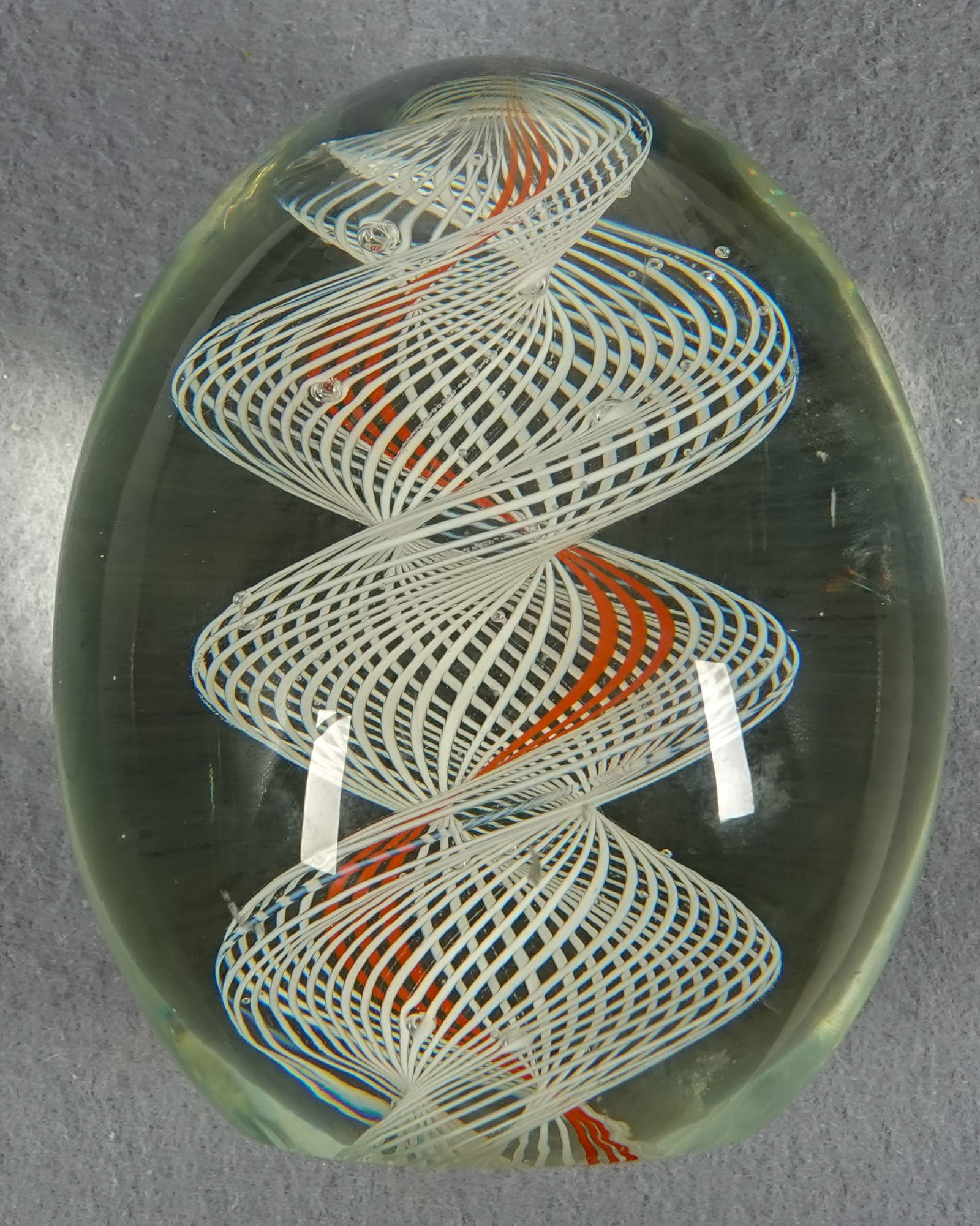 PAPERWEIGHT, Unsigned.: PAPERWEIGHT, Unsigned. Nice Latticinio Ribbon Core. Unsigned, studio unidentified. 2-3/4" width, 3-3/8" height. Mint.