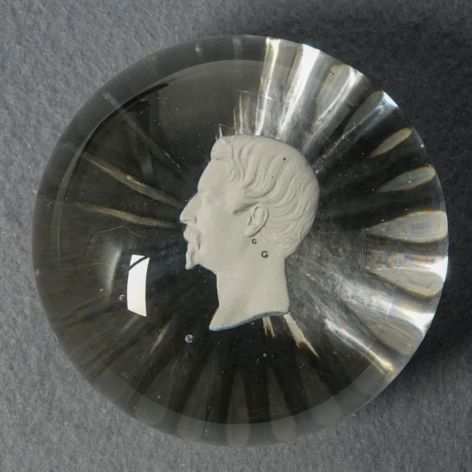 PAPERWEIGHT, Clichy. Sulphide. Napoleon III.: PAPERWEIGHT, Clichy. Sulphide bust of Napoleon III in clear glass. Star cut base. France, circa 1850-1860. 2-7/8" width, 1-7/8" height. Mint.