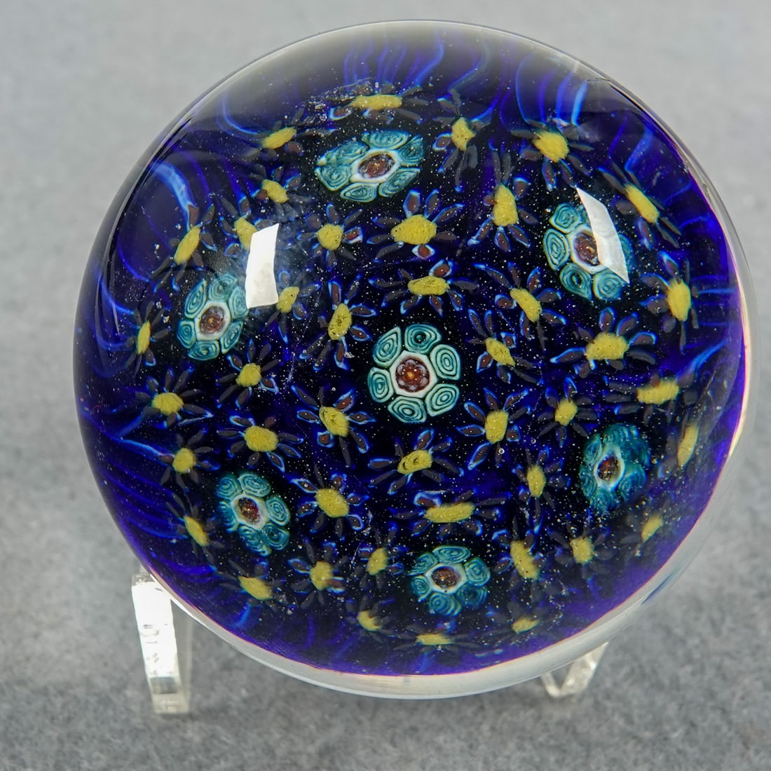 PAPERWEIGHT, Murano. 3 Fiori.: PAPERWEIGHT, Murano. Scattered millefiori. Glass studio is 3 Fiori. Remnants of a paper label on base. Italy, circa 1970-2000. 2-1/8" width, 1-1/2" height. Mint.