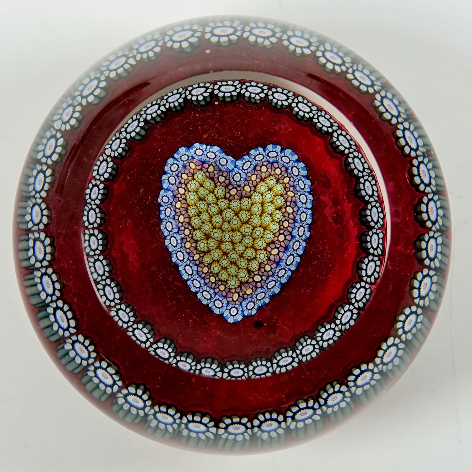 PAPERWEIGHT, Perthshire Paperweights. PP46.: PAPERWEIGHT, Perthshire Paperweights. Perthshire PP46 Heart. 1996 design. Has a "P" cane in the base. Scotland, circa 1996. 2-1/2" width, 1-1/2" height.