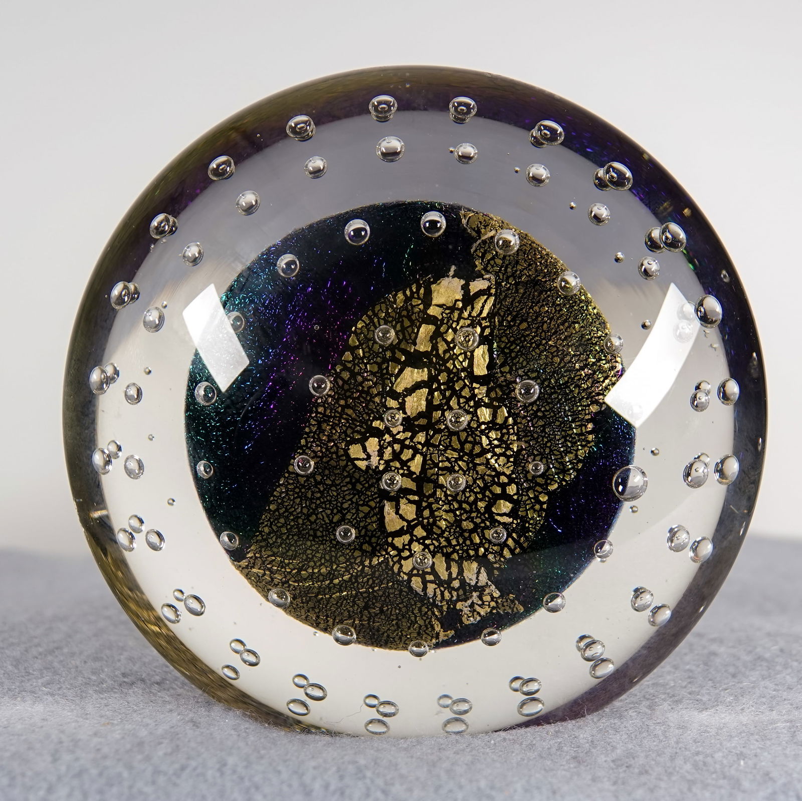 PAPERWEIGHT, Robert Eickholt.: PAPERWEIGHT, Robert Eickholt. Disk shape with flattened bottom and a flattened edge for standing. Signed "Eickholt 1993 DBU. 3-3/4" width, 1-3/4" height. Mint.