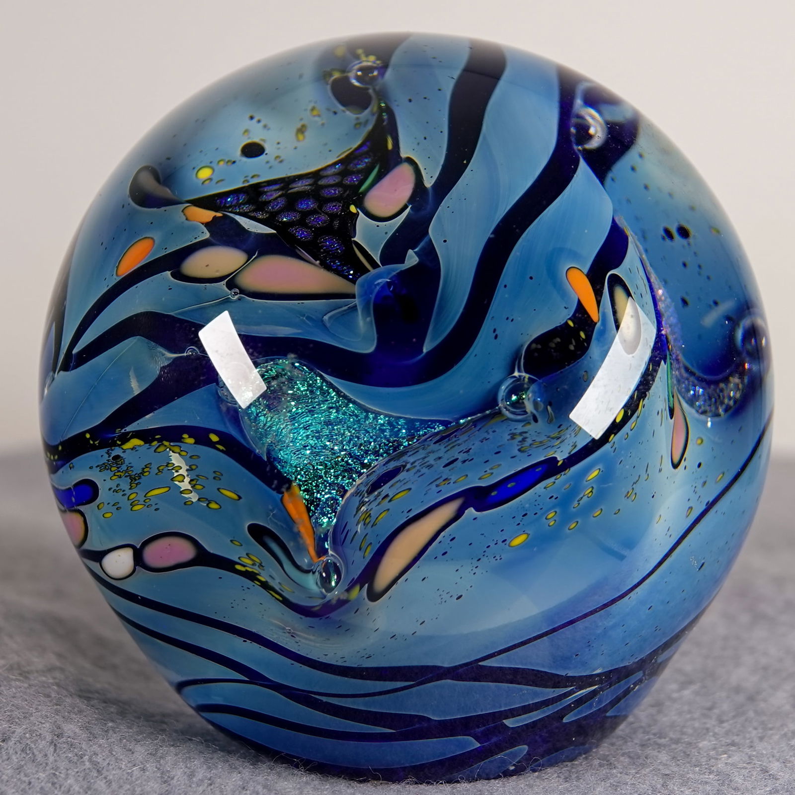 PAPERWEIGHT, Jim Karg.: PAPERWEIGHT, Jim Karg. Planet type with dichroic pieces. Signed "Jim Karg". 2-3/4" width, 2-5/8" height. Mint.