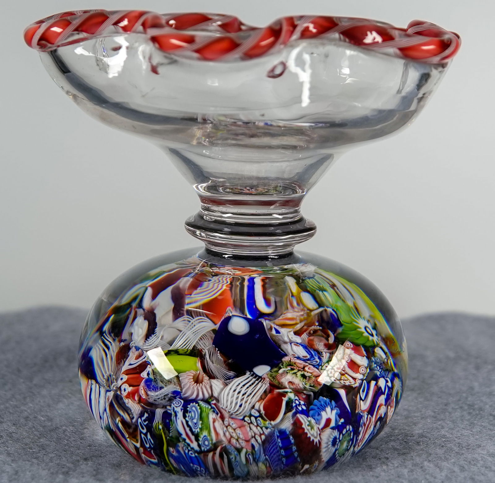 PAPERWEIGHT, St. Louis. Antique. Wafer Stand with Paperweight base.: PAPERWEIGHT, St. Louis. Antique Saint Louis scrambled millefiori with signature cane wafer stand. A clear shallow bowl, with six lobes, adorned with a delicate pink and white twist torsade on the rim.