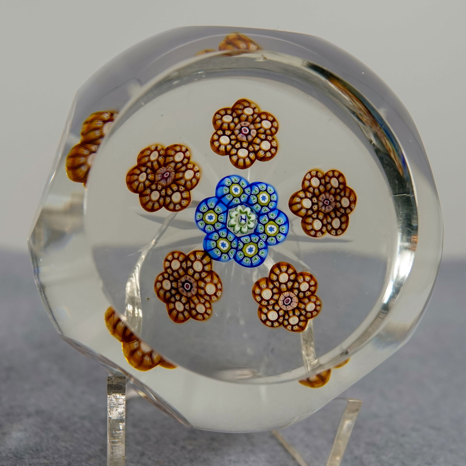 PAPERWEIGHT, Perthshire Paperweights. PP41.: PAPERWEIGHT, Perthshire Paperweights. Perthshire PP14 paperweight. Circlets. Has an "H" cane in it, which would date it to 1976. Star cut base. Top viewing window. Five side windows. 2-5/8" width, 1-5